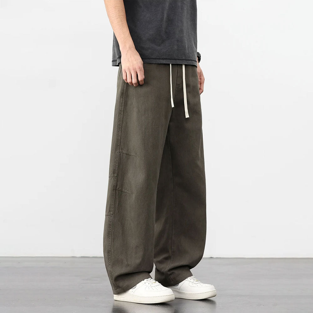 Donkergroene retro katoenen workwear broek met losse pasvorm en trekkoord.