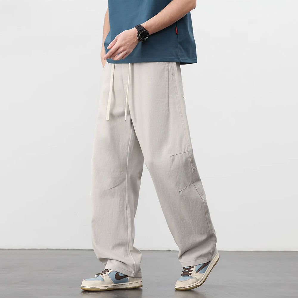 Lichte retro katoenen workwear broek met losse pasvorm, trekkoord en zijzakken.