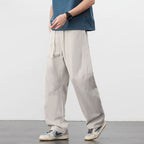 Lichte retro katoenen workwear broek met losse pasvorm, trekkoord en zijzakken.