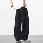 Zwarte retro katoenen workwear broek met losse pasvorm en zichtbare stiksels.