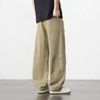 Retro losse workwear broek van beige katoen met knoop- en ritssluiting.