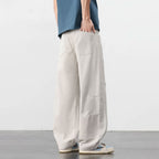 Beige retro katoenen workwear broek met losse pasvorm en cargozakken.