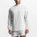 Wit oversized sport-T-shirt met lange mouwen en colkraag, gemaakt van zachte katoenmix.
